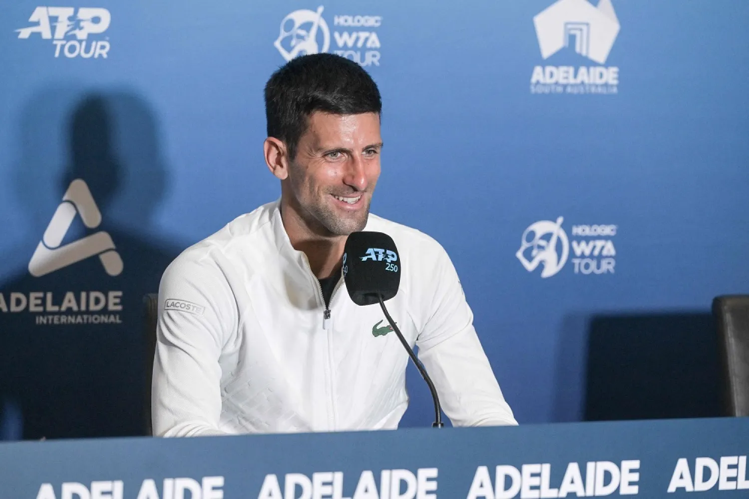 Serbian tennis player Novak Djokovic attends a press conference after winning his first round match against France's Constant Lestienne at the ATP Adelaide International tournament in Adelaide on January 3, 2023. (AFP)
