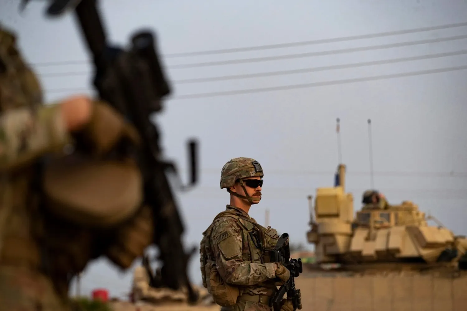 US forces patrol in the vicinity of the Hori rehabilitation center for children of suspected ISIS group, in the town of Tel Maaruf in Syria's northeastern Hasakeh province, on December 15, 2022. (AFP)