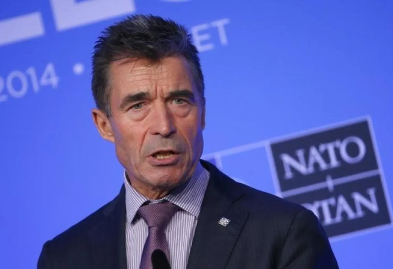 NATO Secretary-General Anders Fogh Rasmussen speaks during a news conference on the second and final day of the NATO summit at the Celtic Manor resort, near Newport, in Wales September 5, 2014. REUTERS/Yves Herman
