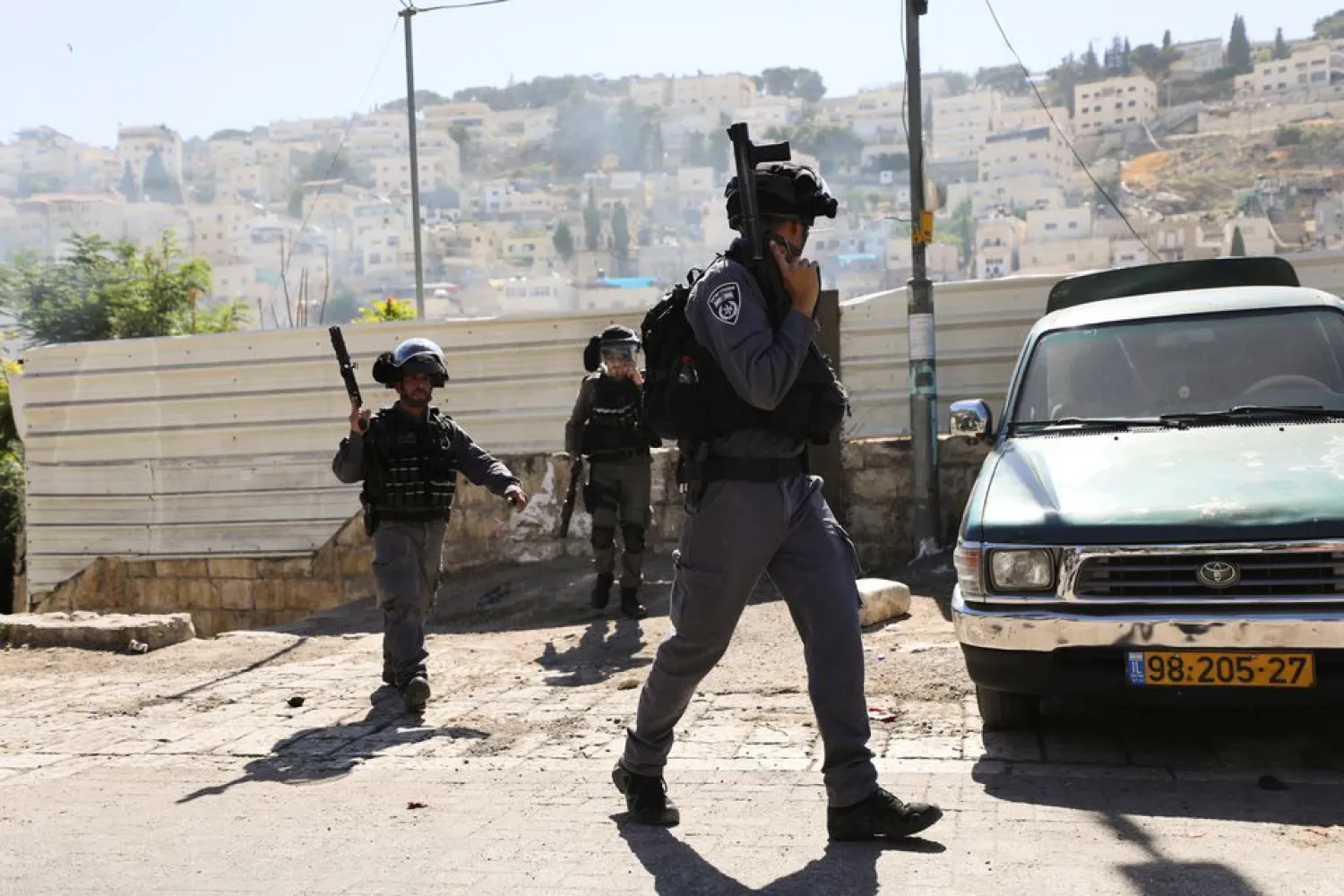 Israeli security force members hold their weapons during clashes with Palestinians which erupted over Israel's demolition of a shop in the Palestinian neighborhood of Silwan in East Jerusalem June 29, 2021. REUTERS/Ammar Awad