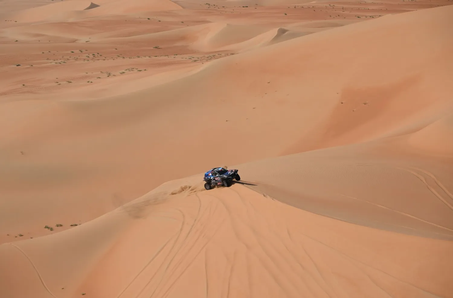 Mini's driver Jakub Przygonski of Poland and his co-driver Timo Gottschalk of Germany compete during the Stage 10 of the Dakar 2023, between Haradh and Shaybah, Saudi Arabia, on January 11, 2023. (AFP)