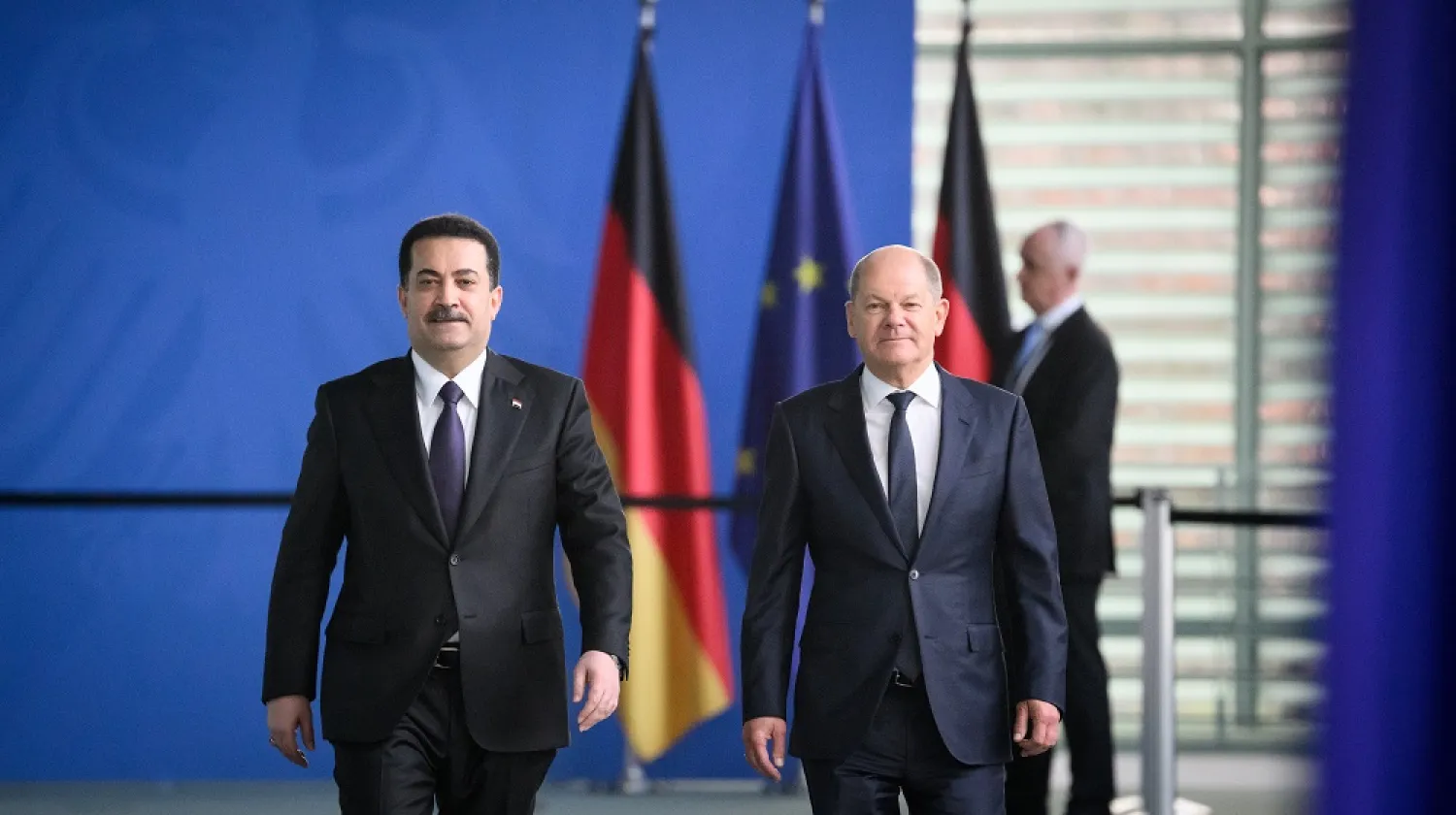 13 January 2023, Berlin: German Chancellor Olaf Scholz (R) and Prime minister of Iraq Mohammed Shia al-Sudani arrive for a press conference after their talks at the Chancellor's Office. (dpa)