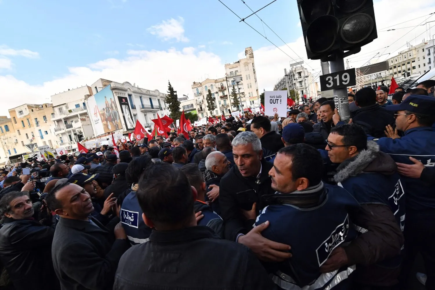 Tunisian demonstrators carry placards during a protest in central Tunis against their president on January 14, 2023. (AFP)