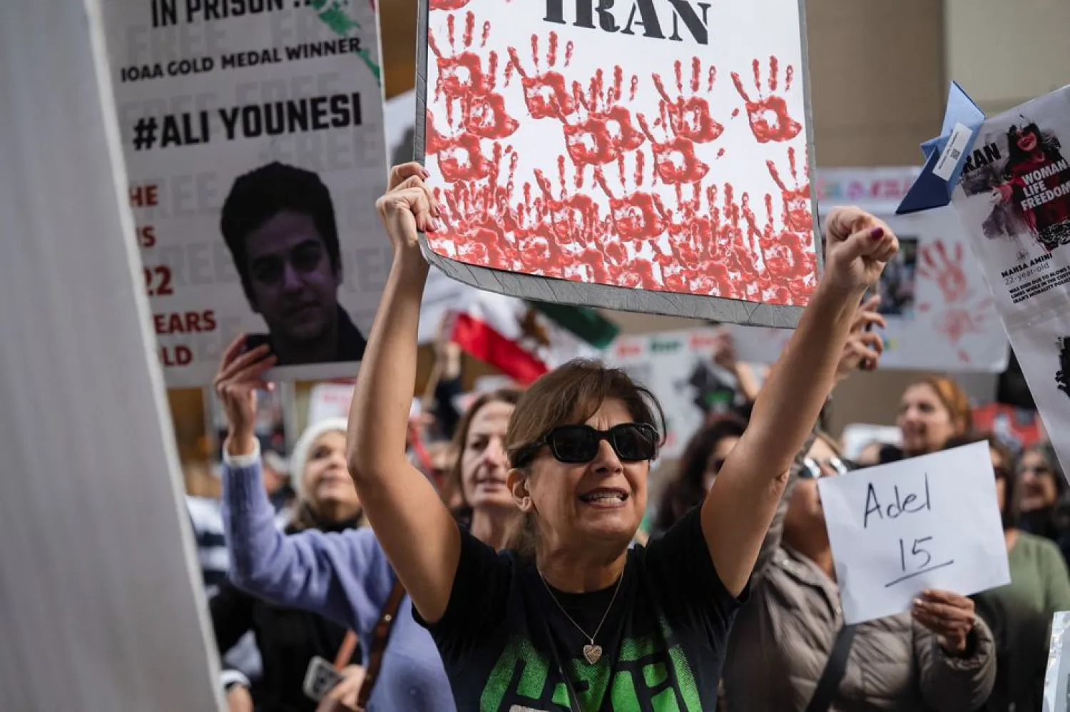 A woman chants during a protest against violence in Iran, in front of the United Nations Children’s Fund (UNICEF) office in San Francisco, California, US, November 30, 2022. REUTERS/Amy Osborne