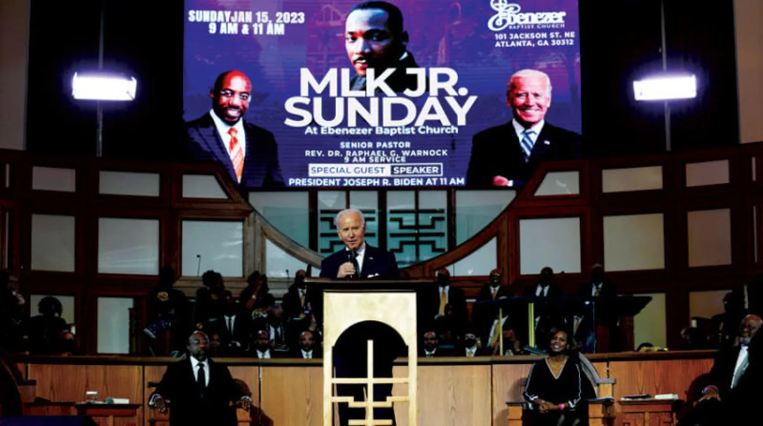 بايدن أثناء حضوره إحياء ذكرى مارتن لوثر كينغ (أ.ب)