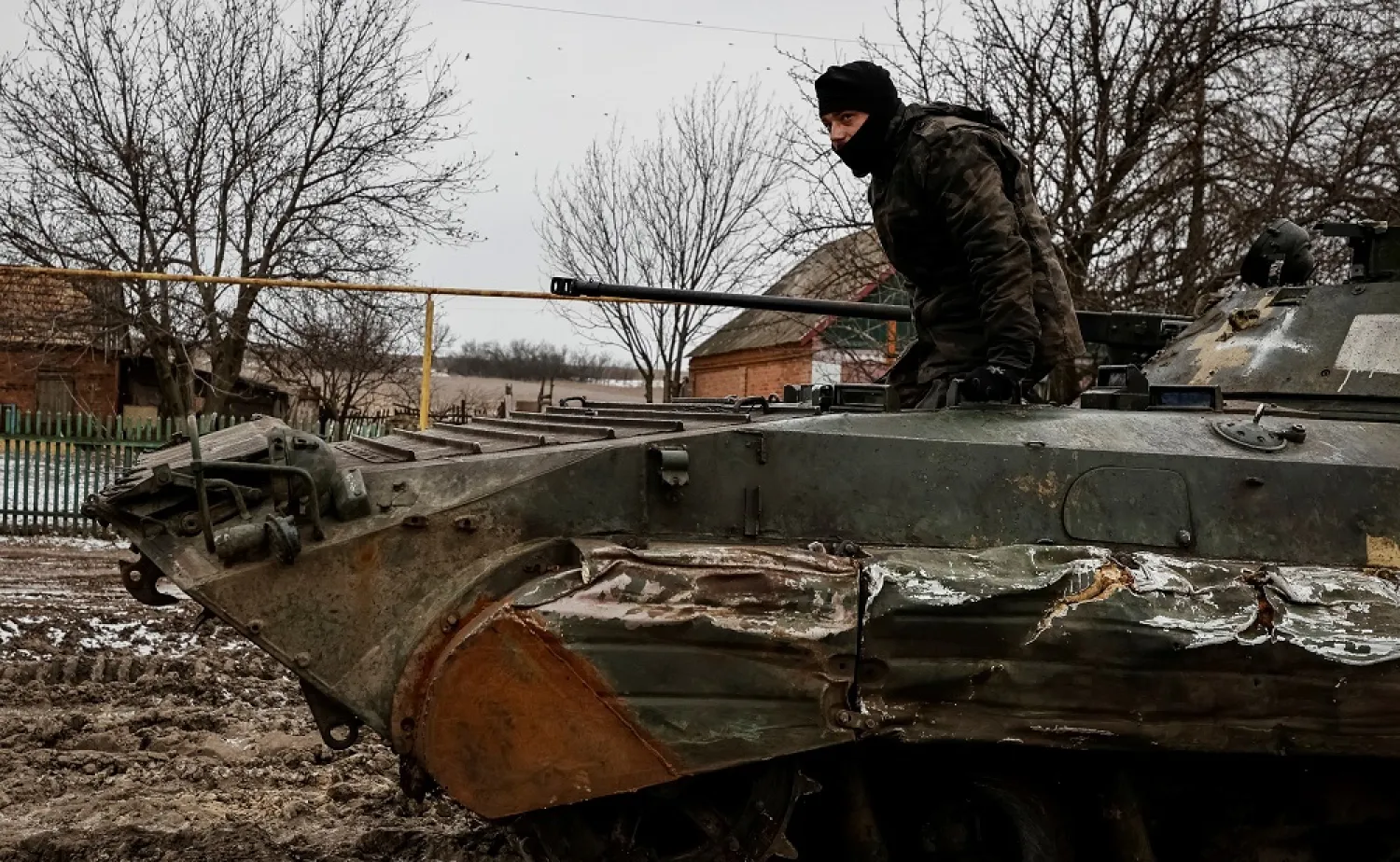 A Ukrainian service member stands in a BMP-2 infantry fighting vehicle, amid Russia's attack on Ukraine, on a frontline near the town of Soledar in Donetsk region, Ukraine January 14, 2023. (Reuters)