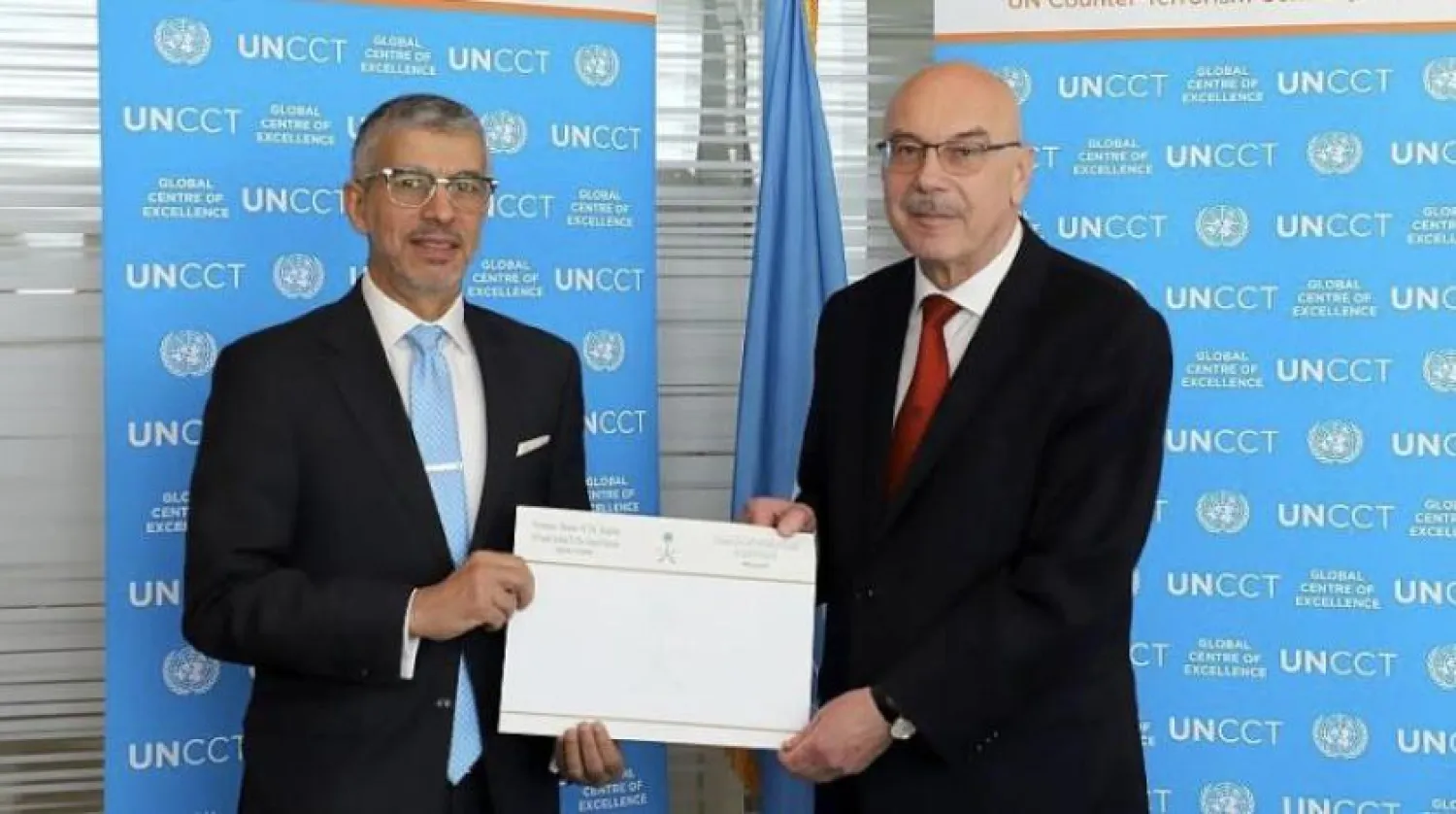 Saudi Ambassador Abdulaziz Al-Wasel delivers the cheque to Vladimir Vornkov at the UN headquarters. SPA
