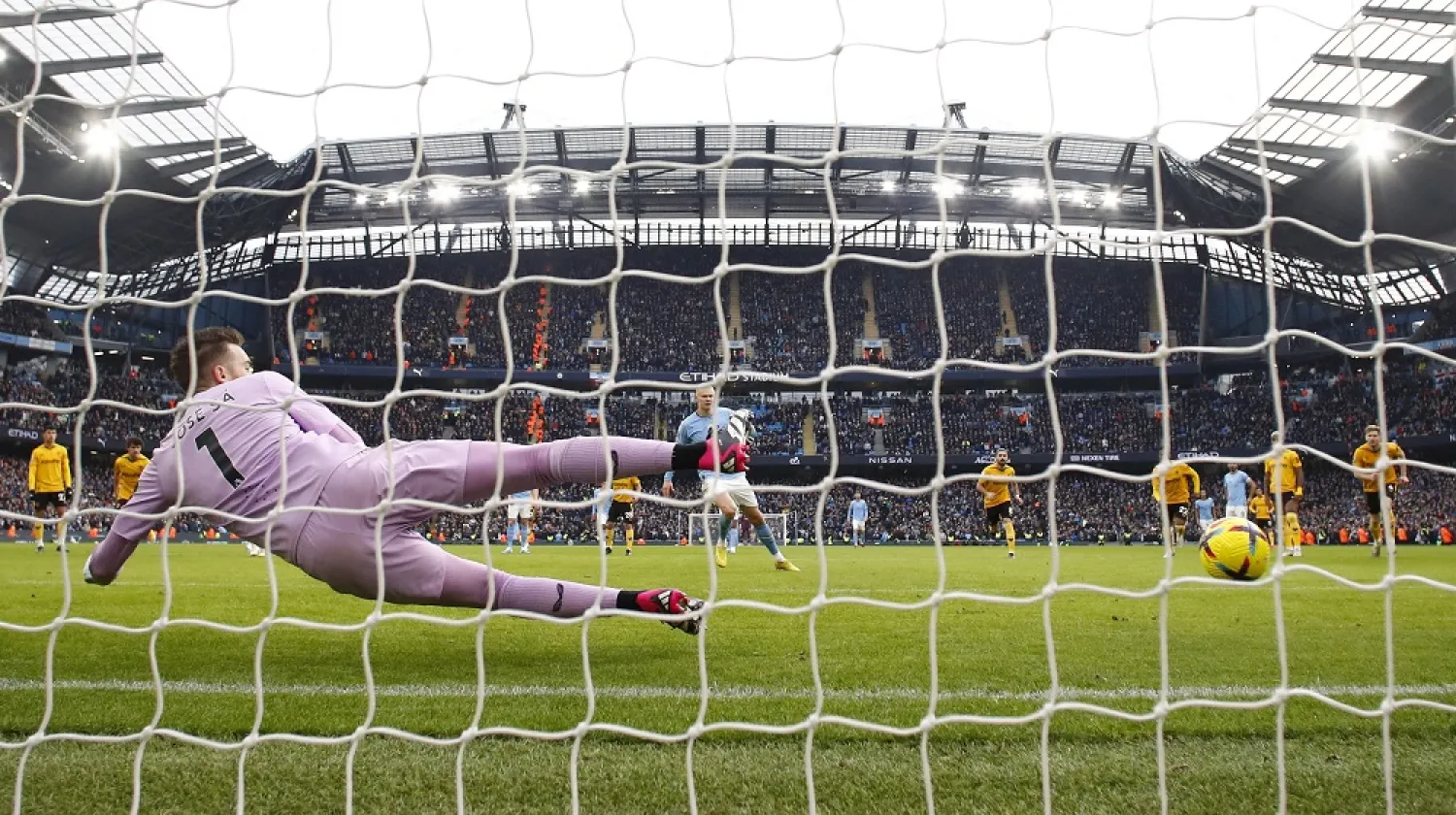 Football - Premier League - Manchester City v Wolverhampton Wanderers - Etihad Stadium, Manchester, Britain - January 22, 2023 Manchester City's Erling Haaland scores their second goal from the penalty spot past Wolverhampton Wanderers' Jose Sa. (Reuters)