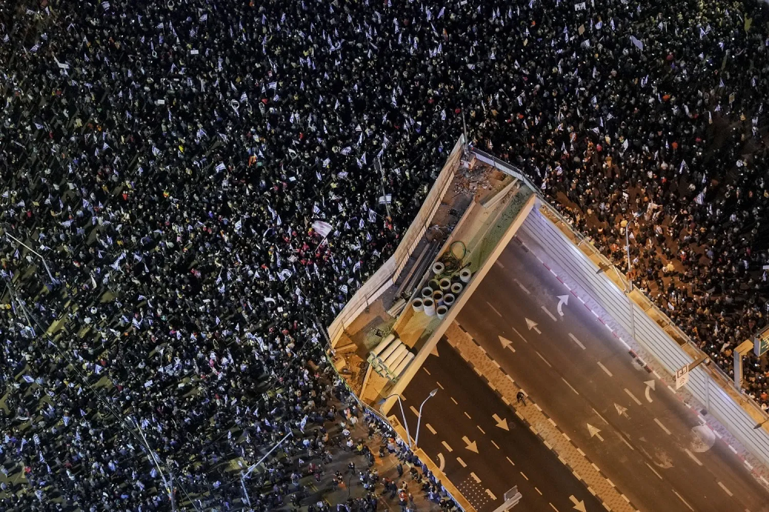 Tens of thousands of Israelis protest against the plans by Prime Minister Benjamin Netanyahu's new government to overhaul the judicial system, in Tel Aviv, Israel, Saturday, Jan. 21, 2023. (AP)