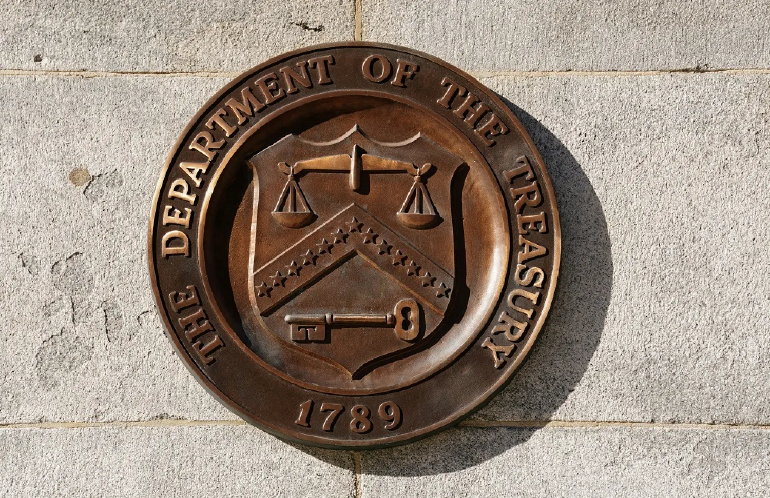 A bronze seal for the Department of the Treasury is shown at the US Treasury building in Washington, US, January 20, 2023. (Reuters)
