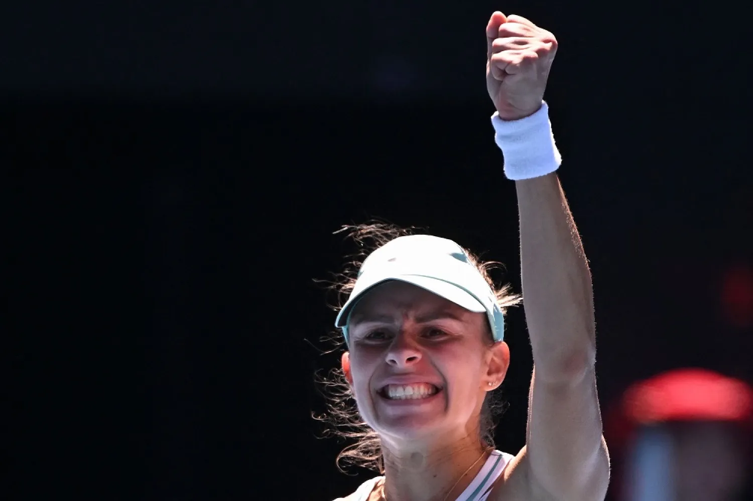 Poland's Magda Linette celebrates victory against France's Caroline Garcia after their women's singles match on day eight of the Australian Open tennis tournament in Melbourne on January 23, 2023. (AFP)
