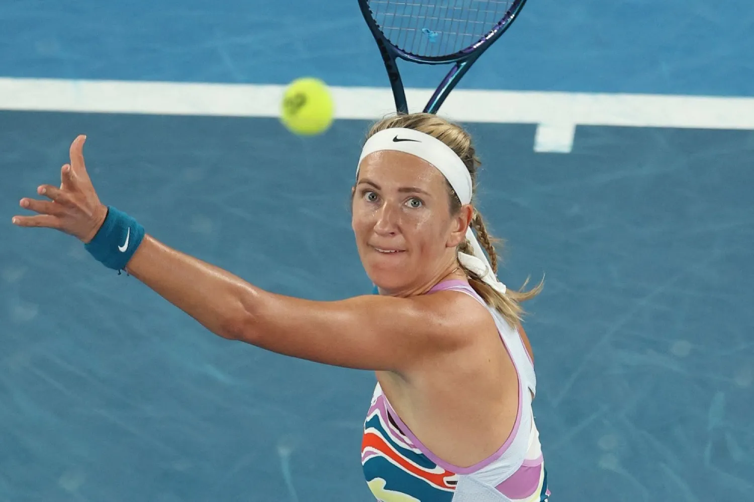 Belarus' Victoria Azarenka hits a return against Jessica Pegula of the US during their women's singles quarterfinal match on day nine of the Australian Open tennis tournament in Melbourne on January 24, 2023. (AFP) 