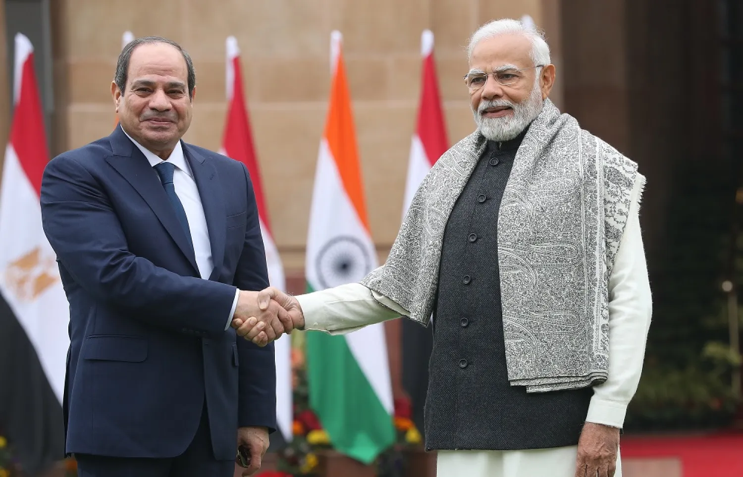 India's Prime Minister Narendra Modi (R) and Egypt's President Abdel Fattah al-Sisi (L) shake hands prior to a meeting at the Hyderabad House in New Delhi, India, 25 January 2023. (EPA)