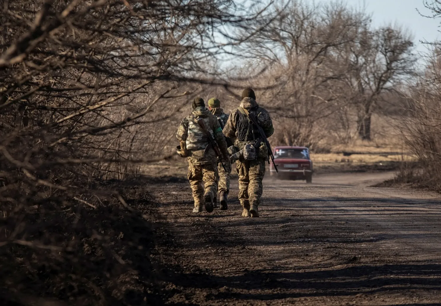 Ukrainian servicemen walk near the frontline, amid Russia's attack on Ukraine, near Soledar in Donetsk region, Ukraine January 23, 2023. (Reuters)

