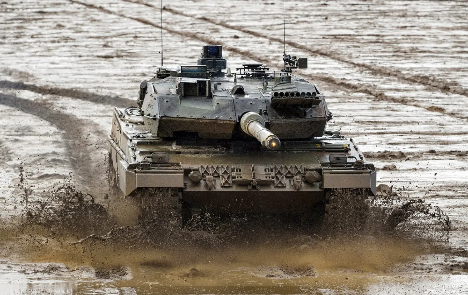 07 February 2022, Lower Saxony, Munster: A Bundeswehr Leopard 2A6 main battle tank drives across the training range during a combat demonstration in Munster. (dpa)
