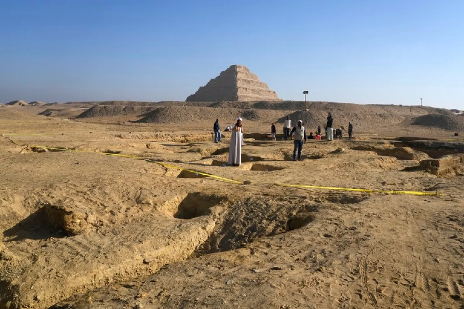Egyptian antiquities workers dig at the site of the Step Pyramid of Djoser in Saqqara, 24 kilometers southwest of Cairo, Egypt, Thursday, Jan. 26, 2023. (AP Photo/Amr Nabil)