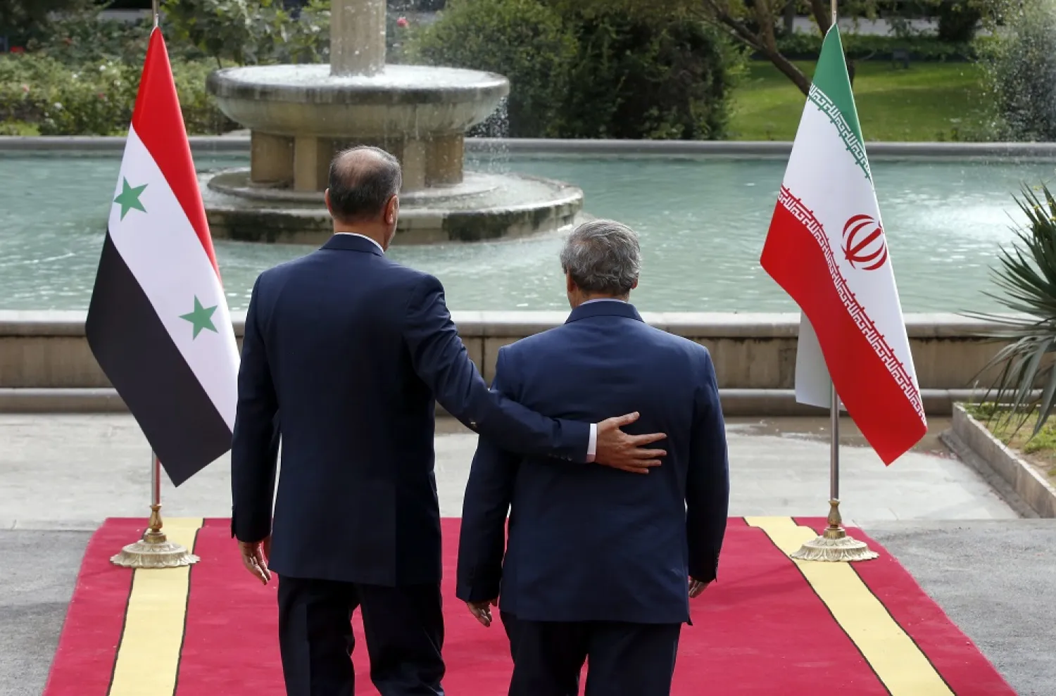 Iranian foreign minister Hossein Amir-Abdollahian (L) greets his Syrian counterpart Faisal Mekdad (R) in Tehran, Iran, 02 November 2022. (EPA)