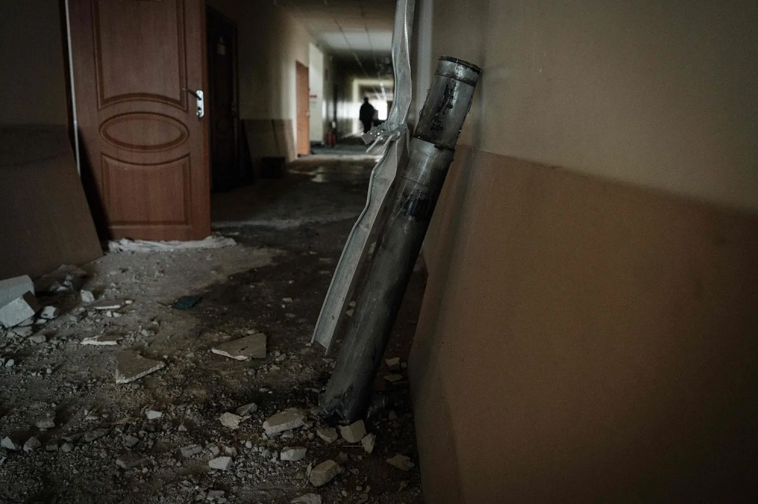 A part of a rocket that penetrated the rooftop overnight remains at a corridor of an elementary school in Chasiv Yar on January 28, 2023, amid the Russian invasion of Ukraine. (AFP)