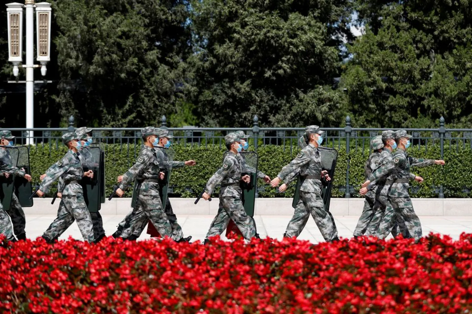 Soldiers of the People's Liberation Army (PLA) march outside the Great Hall of the People in Beijing, China September 8, 2020. REUTERS/Carlos Garcia Rawlins/File Photo