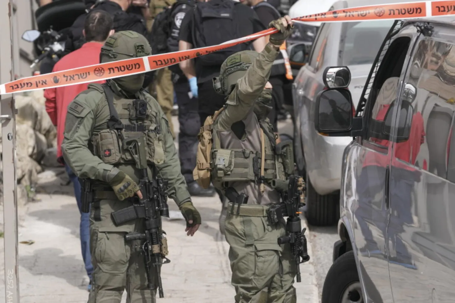 Israeli policemen secure a shooting attack site in east Jerusalem, Saturday, Jan. 28, 2023. (AP)

