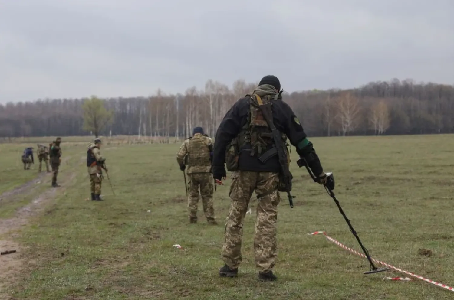 Military sappers inspect an area for mines and non-exploded shells left after Russia's invasion in Kyiv Region, Ukraine April 21, 2022. REUTERS/Mykola Tymchenko/File Photo





