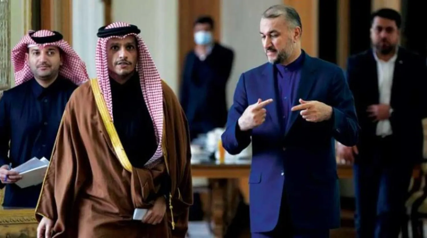 Iran's Foreign Minister Hossein Amirabdollahian with his Qatari counterpart Mohammed bin Abdulrahman Al Thani in Tehran on Sunday. (AP) 
