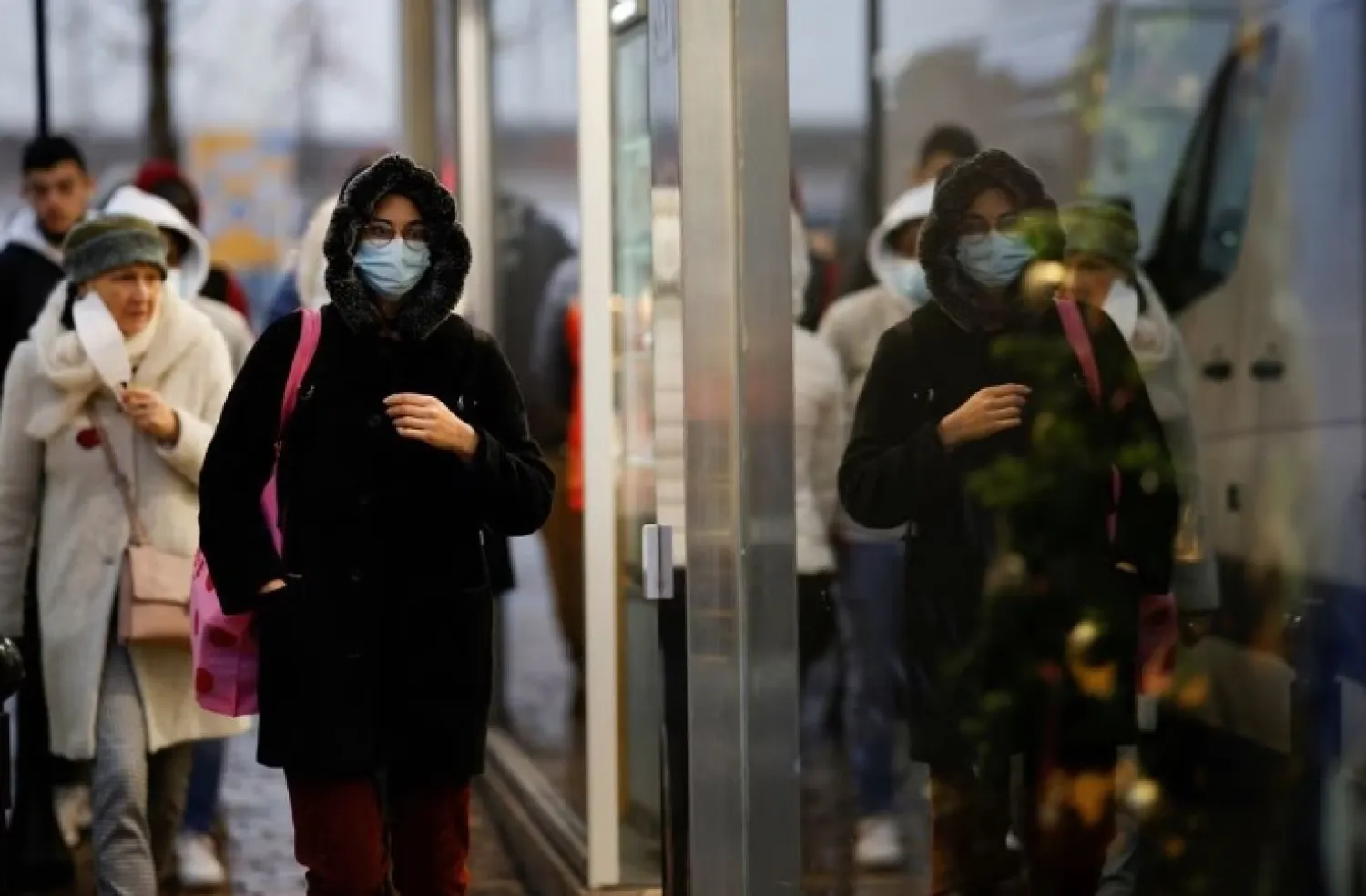 People wearing face masks walk in Nantes amid the coronavirus disease (COVID-19) outbreak in France, December 9, 2021. REUTERS/Stephane Mahe