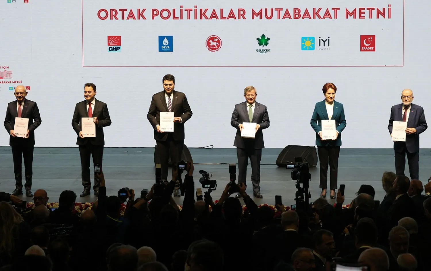 Republican People's Party (CHP) Kemal Kilicdaroglu (L), IYI Party Meral Aksener (2ndR), Felicity Party (Saadet) Temel Karamollaoglu (R), Democratic Party (DP) Gultekin Uysal (3rdL), Future Party (Gelecek) Ahmet Davutoglu (3rdR), and Democracy and Progress (DEVA) Party Ali Babacan (2ndL), belonging to the Turkish opposition alliance called National Alliance, pose on stage before presenting their program, in Ankara, on January 30, 2023. (AFP)