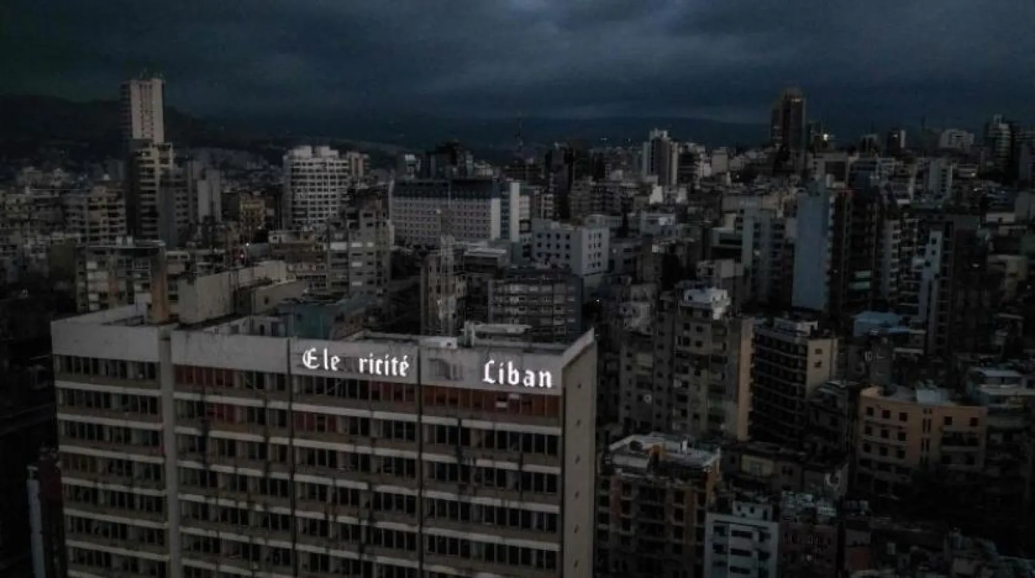 This file photo taken on April 3, 2021 shows an aerial view of Lebanon's capital Beirut in darkness during power outage. (Photo by Dylan COLLINS / AFP)
