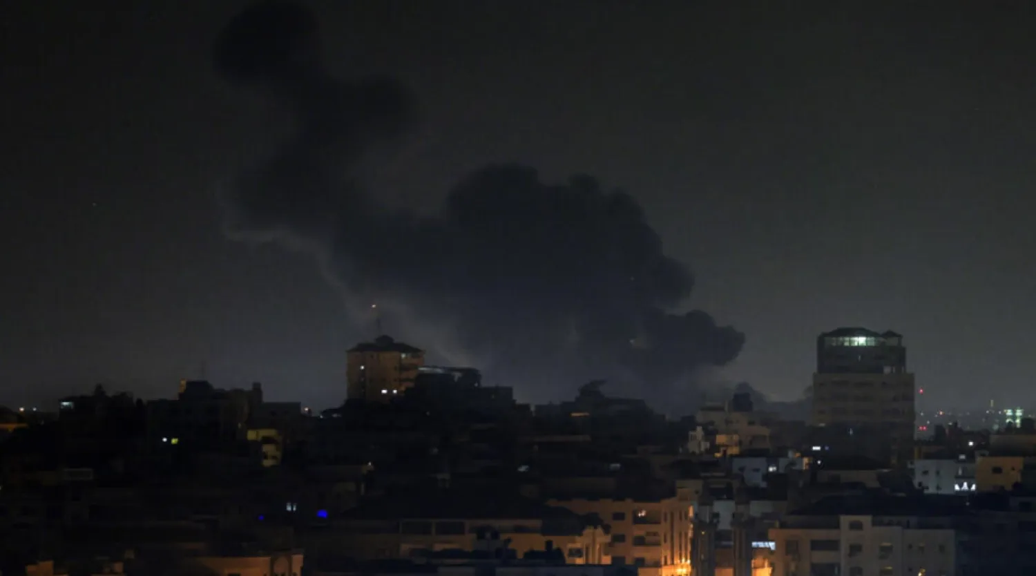 Smoke rises above buildings in Gaza City as Israel launched air strikes on the Palestinian enclave early Thursday © MOHAMMED ABED / AFP
