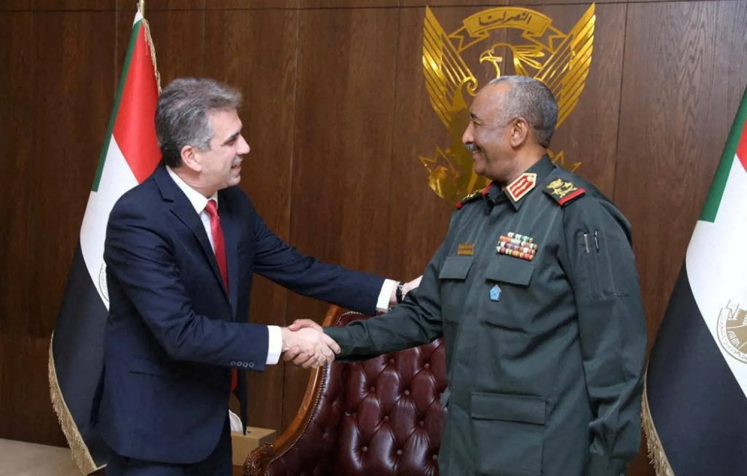 Sudan's sovereign council head General Abdel Fattah al-Burhan meets Israeli foreign minister Eli Cohen in Khartoum, Sudan February 2, 2023. (Sudan Sovereignty Council Press Office/Handout via Reuters)
