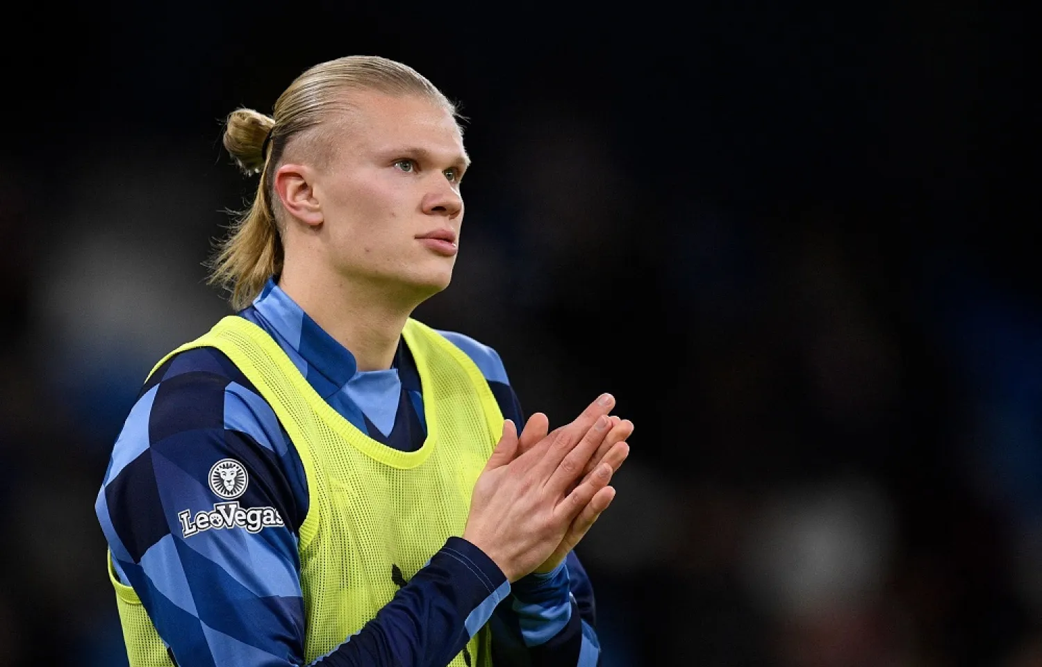 Manchester City's Norwegian striker Erling Haaland warms up before the English FA Cup fourth round football match between Manchester City and Arsenal at the Etihad Stadium in Manchester, northwest England, on January 27, 2023. (AFP)