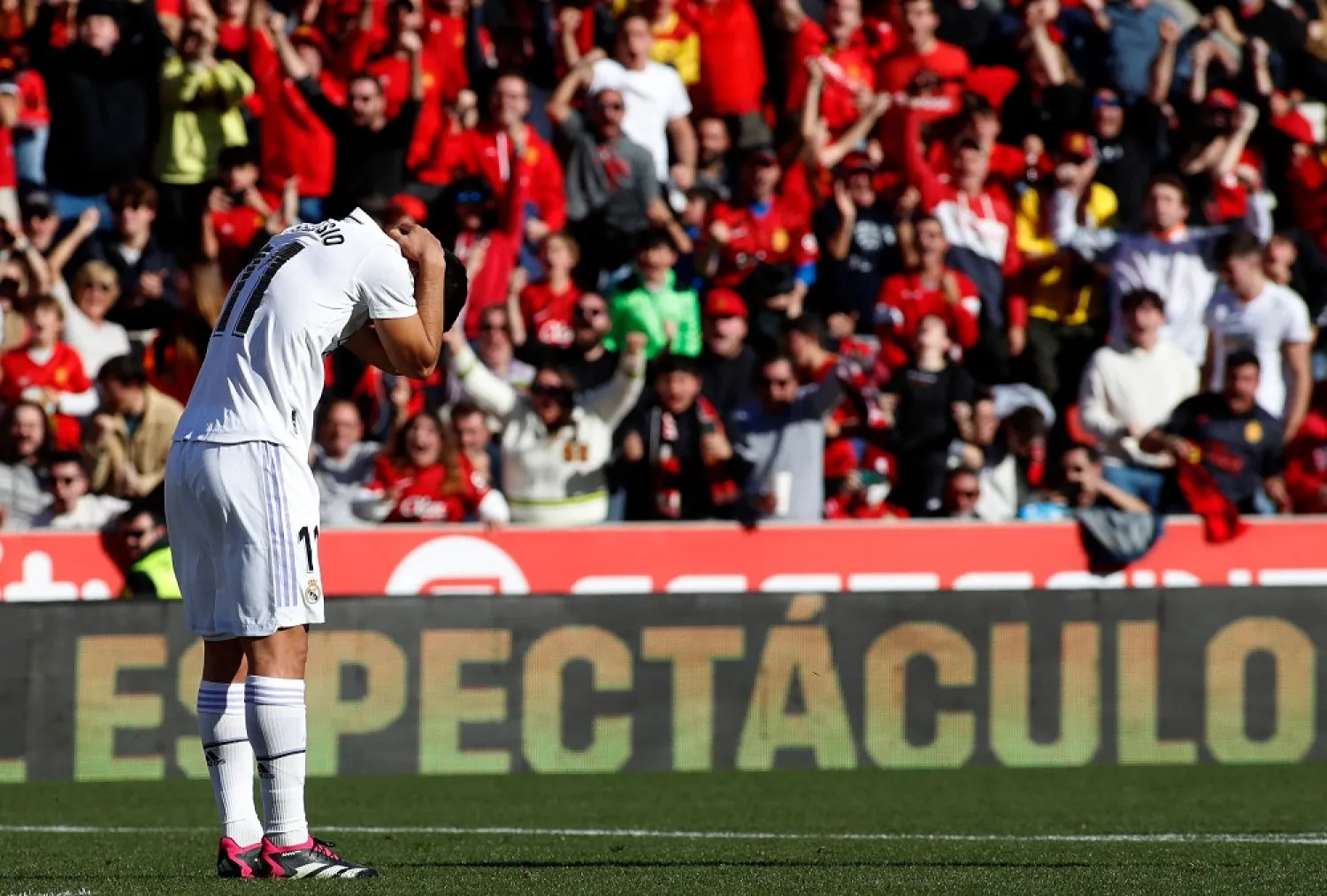 Real Madrid's Spanish midfielder Marco Asensio reacts after failing to score during the Spanish League football match between RCD Mallorca and Real Madrid at the Visit Mallorca stadium in Palma de Mallorca on February 5, 2023. (AFP)