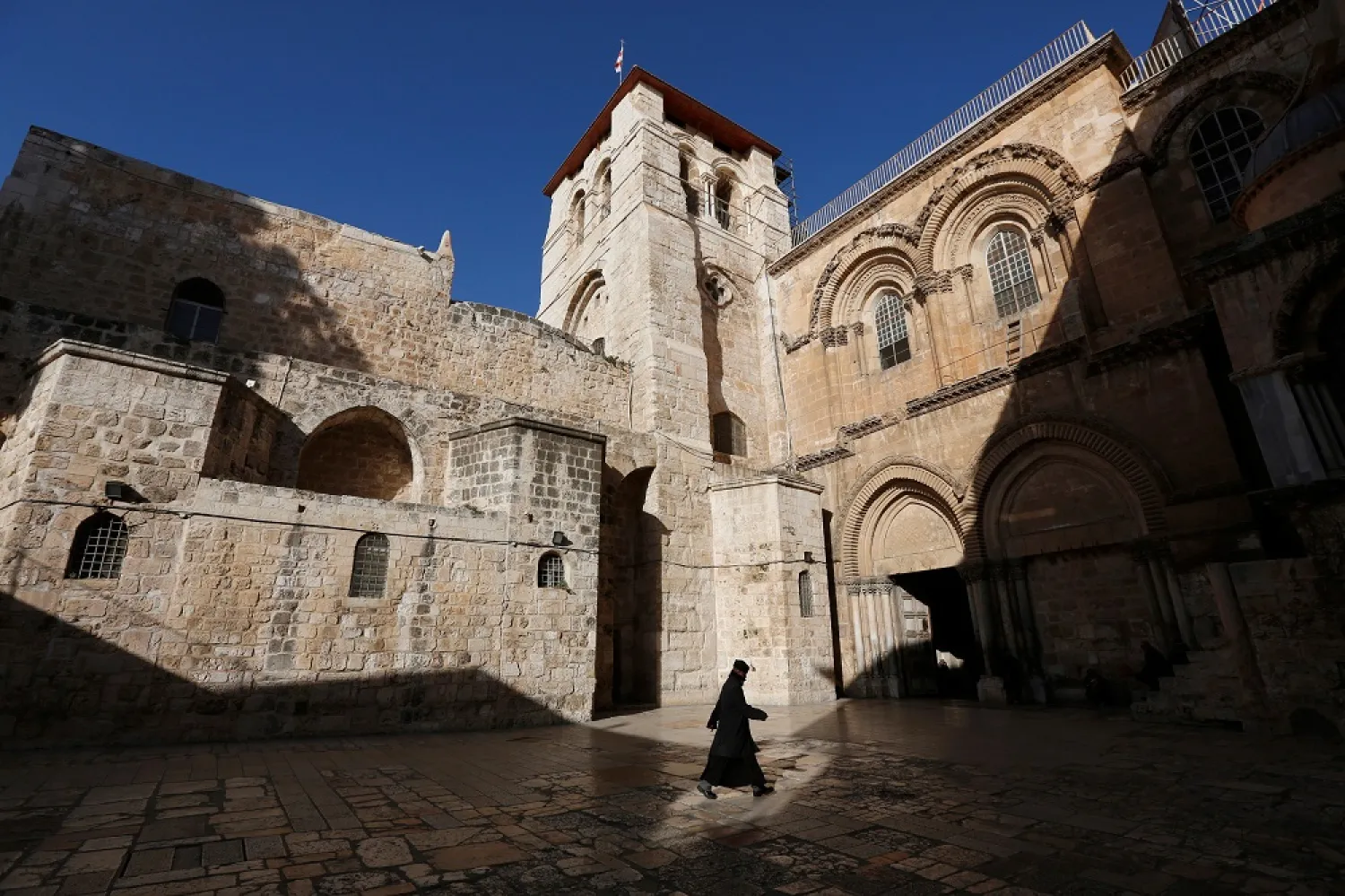 A monk walks outside Jerusalem's Church of the Holy Sepulcher in 2013. (Reuters) 