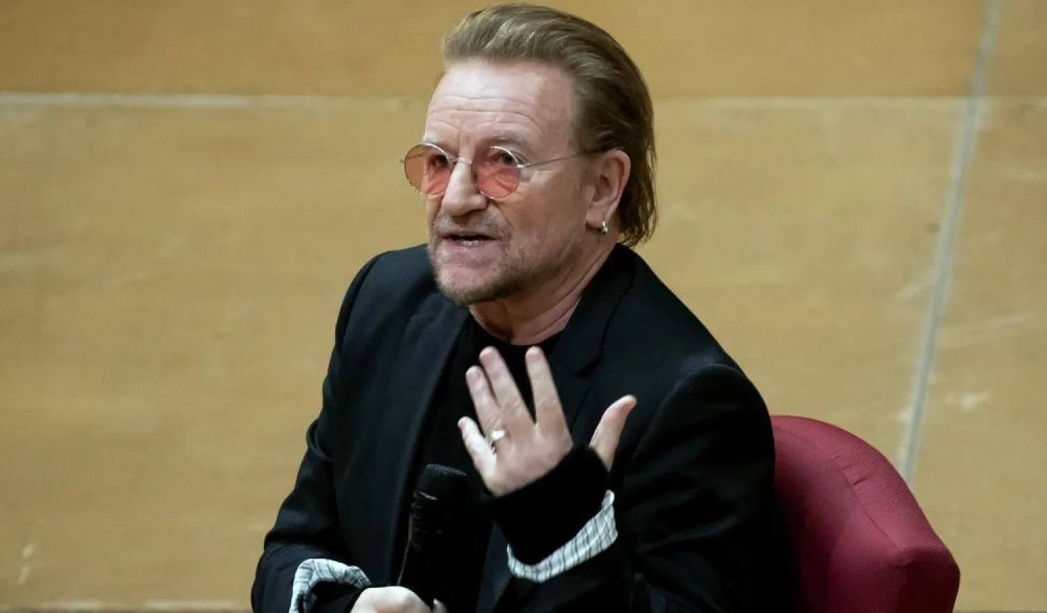 Bono speaks with Cathedral Canon historian Jon Meacham at the Washington National Cathedral on Dec. 5, 2022, in Washington. (AP)