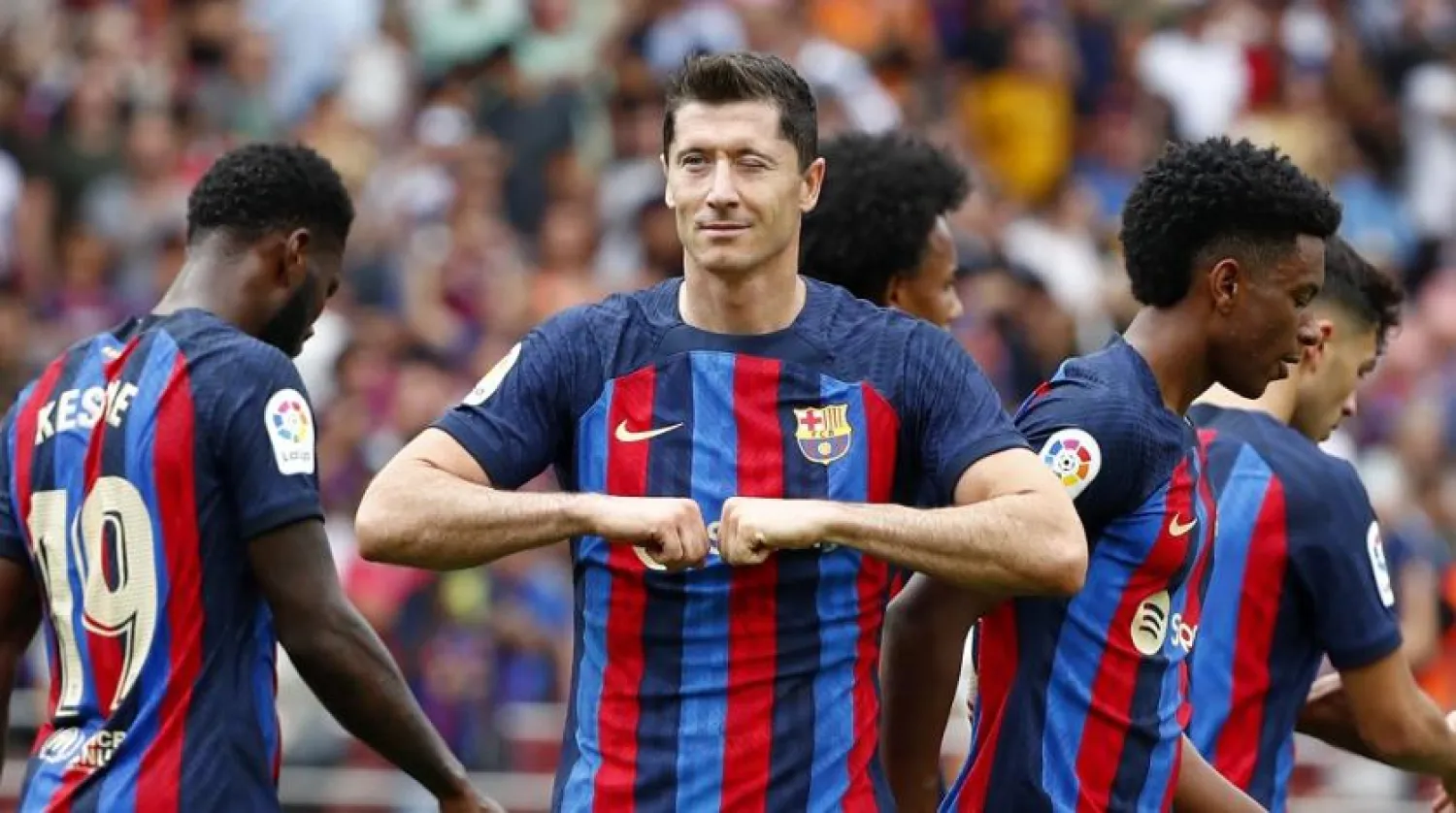 Barcelona's Robert Lewandowski celebrates after scoring the opening goal during a Spanish LaLiga match between FC Barcelona and Elche CF at Camp Nou stadium in Barcelona, Spain, Saturday, Sept. 17, 2022. (AP)
