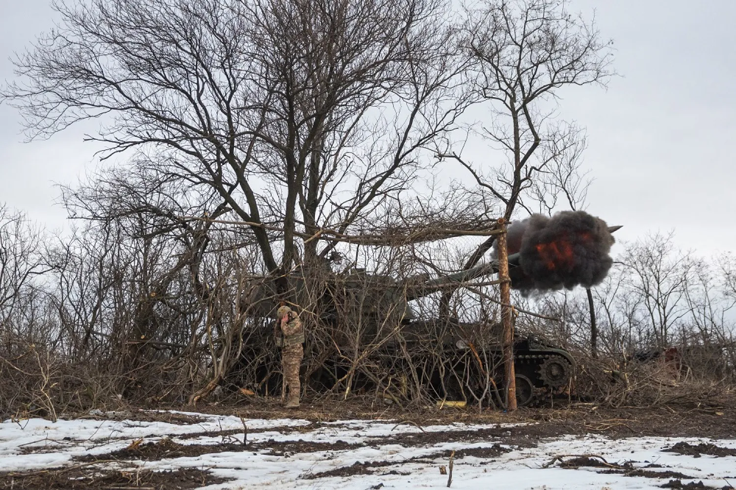 Ukrainian servicemen of the 28th Independent Mechanised Brigade fire 2S3 Akatsiya self-propelled howitzer towards Russian positions, near the frontline town of Bakhmut, as Russia's attack on Ukraine continues, Donetsk region, Ukraine February 25, 2023. (Reuters)