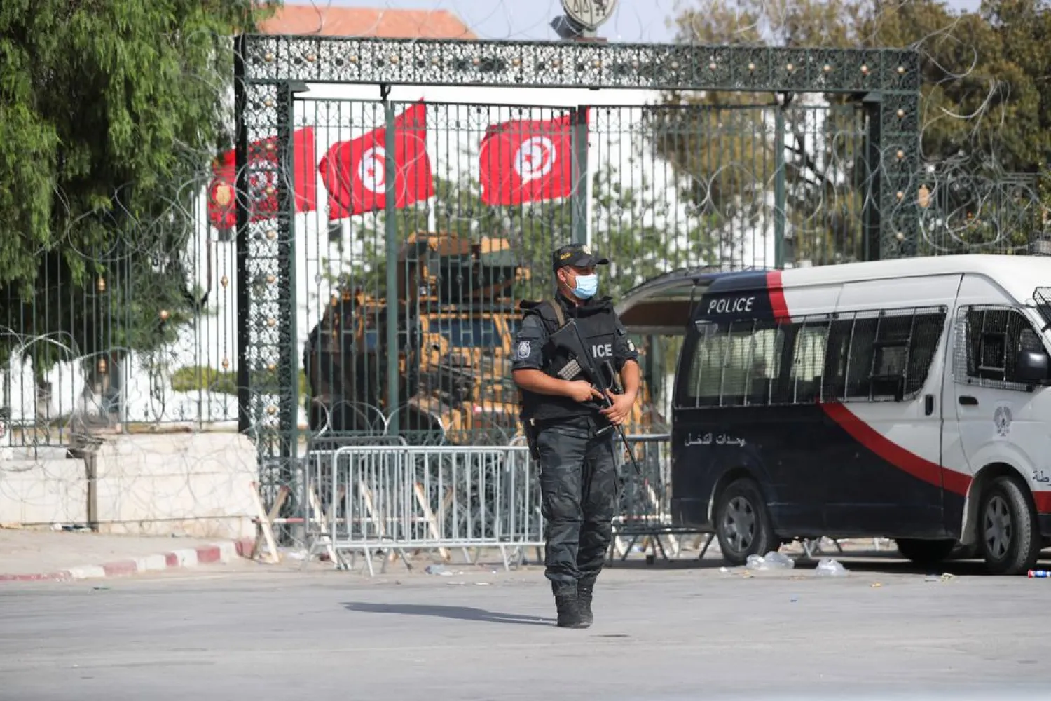 A police officer stands guard outside the parliament building in Tunis,Tunisia July 29, 2021. REUTERS/Ammar Awad