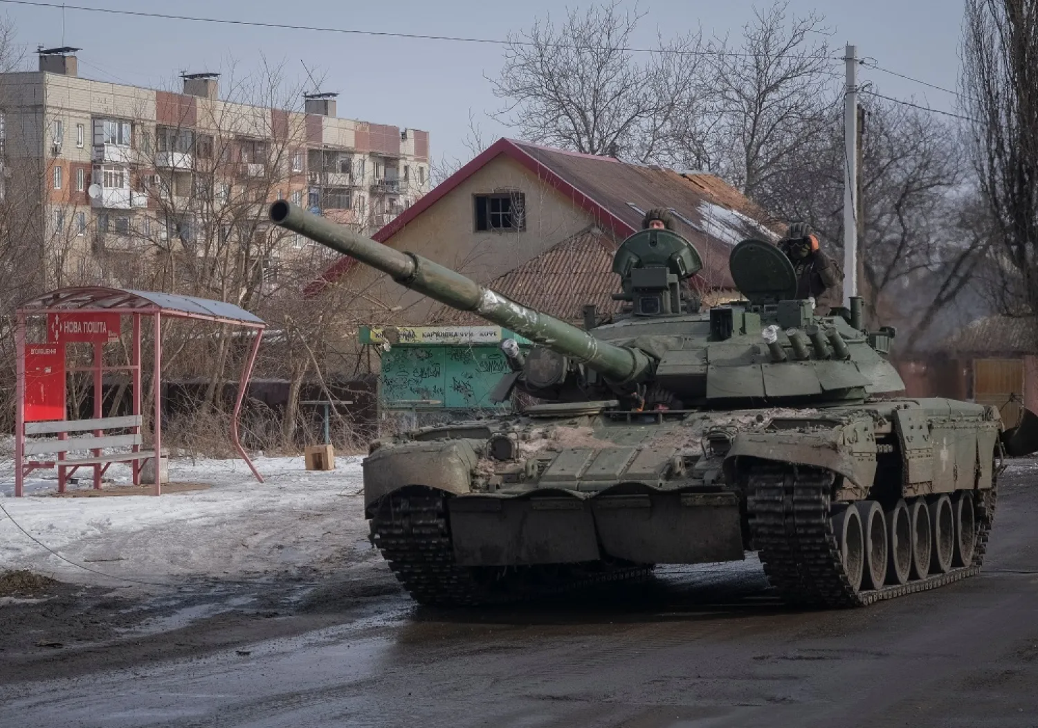 Ukrainian service members ride a tank, amid Russia's attack on Ukraine, in the front line city of Bakhmut, Ukraine February 24, 2023. (Reuters)