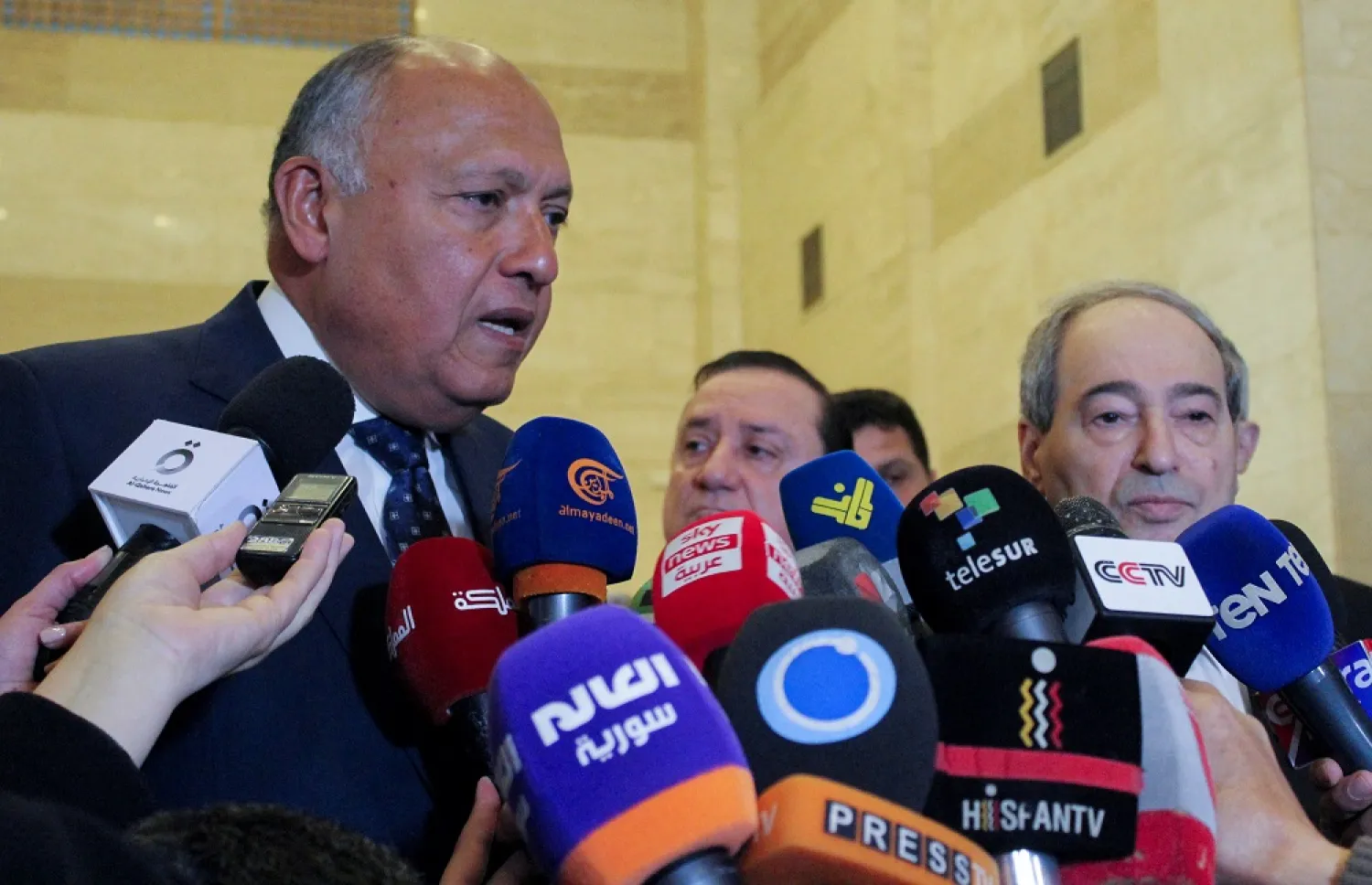 Egypt's Foreign Minister Sameh Shoukry stands next to Syrian Foreign Minister Faisal Mekdad as he speaks during a joint news conference in Damascus, Syria February 27, 2023. (Reuters)