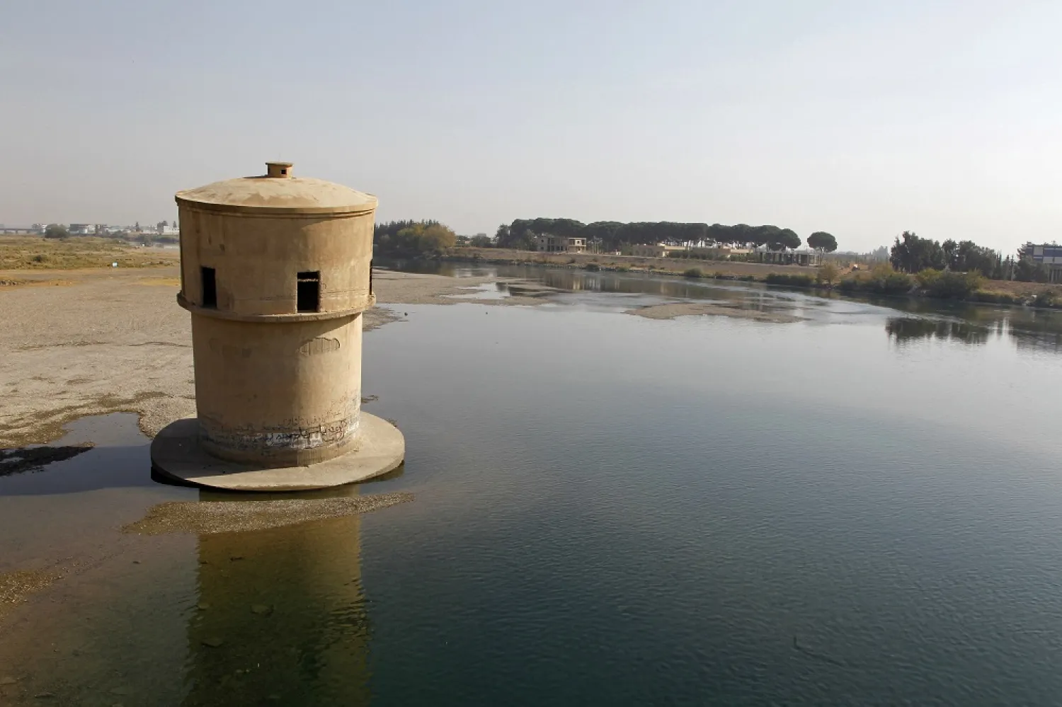 A view of the receding waters of the Euphrates river near the city of Raqqa in eastern Syria, with marks on an old observation tower showing higher levels of water in the past, November 11, 2010. (Reuters)