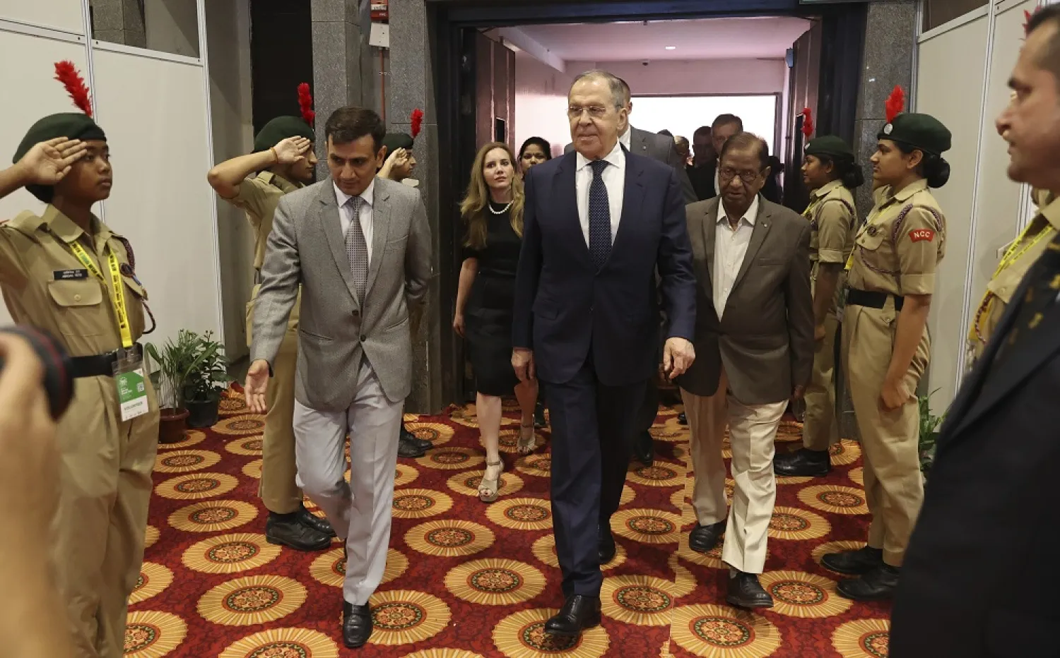 In this handout photo released by Russian Foreign Ministry Press Service, Russian Foreign Minister Sergei Lavrov, center, arrives to attend the opening ceremony of exhibition ''Leo Tolstoy – Mahatma Gandhi'' on the sideline of G20 foreign minister's meeting in New Delhi, India, Wednesday, March 1, 2023. (Russian Foreign Ministry Press Service via AP) 