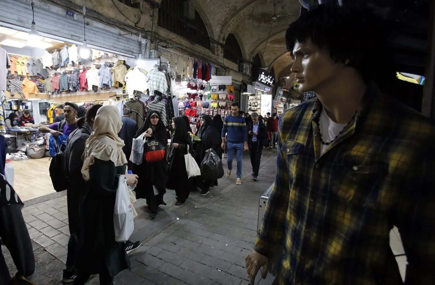 Iranians go shopping in Tehran's grand bazaar in Tehran, Iran, 01 March 2023. (EPA)