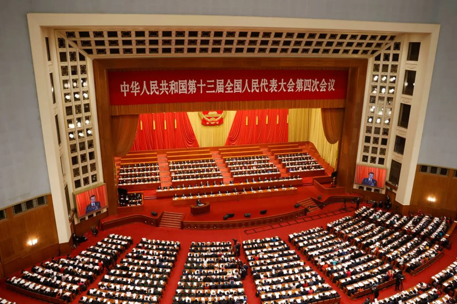 Chinese Premier Li Keqiang speaks at the opening session of the National People's Congress (NPC) at the Great Hall of the People in Beijing, China March 5, 2021. REUTERS/Carlos Garcia Rawlins