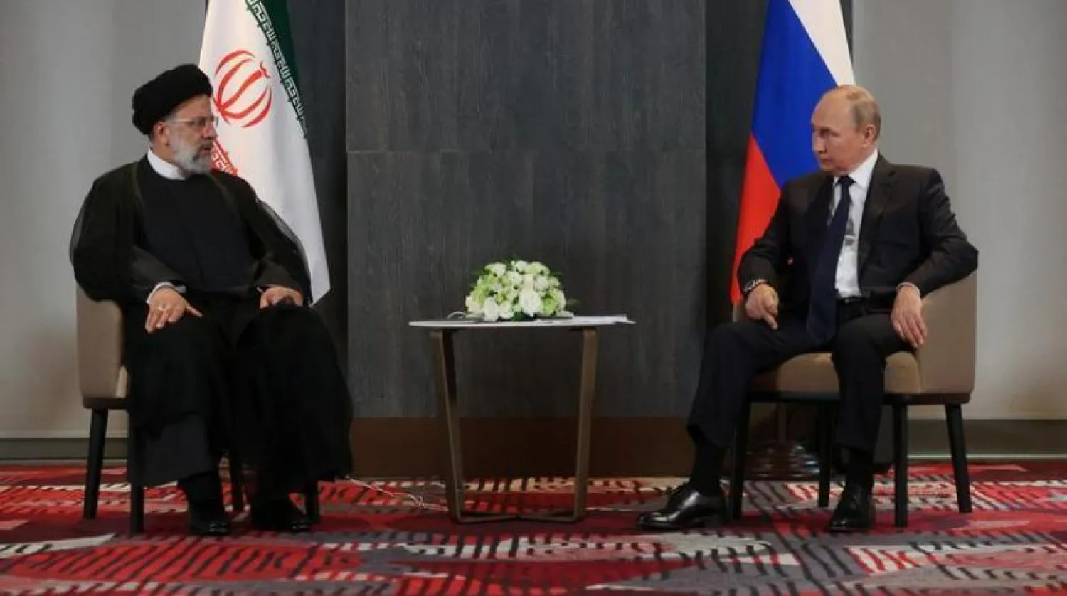 Putin ve Reisi, geçen yıl Şanghay İşbirliği Örgütü zirvesinin oturum aralarında görüştü (Reuters)
