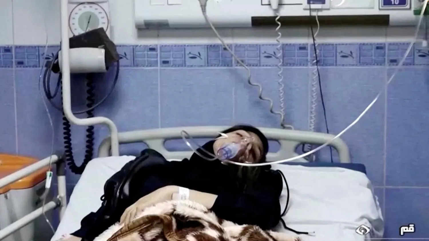 A young woman lies in hospital after reports of poisoning at an unspecified location in Iran in this still image from video from March 2, 2023. WANA/Reuters TV 