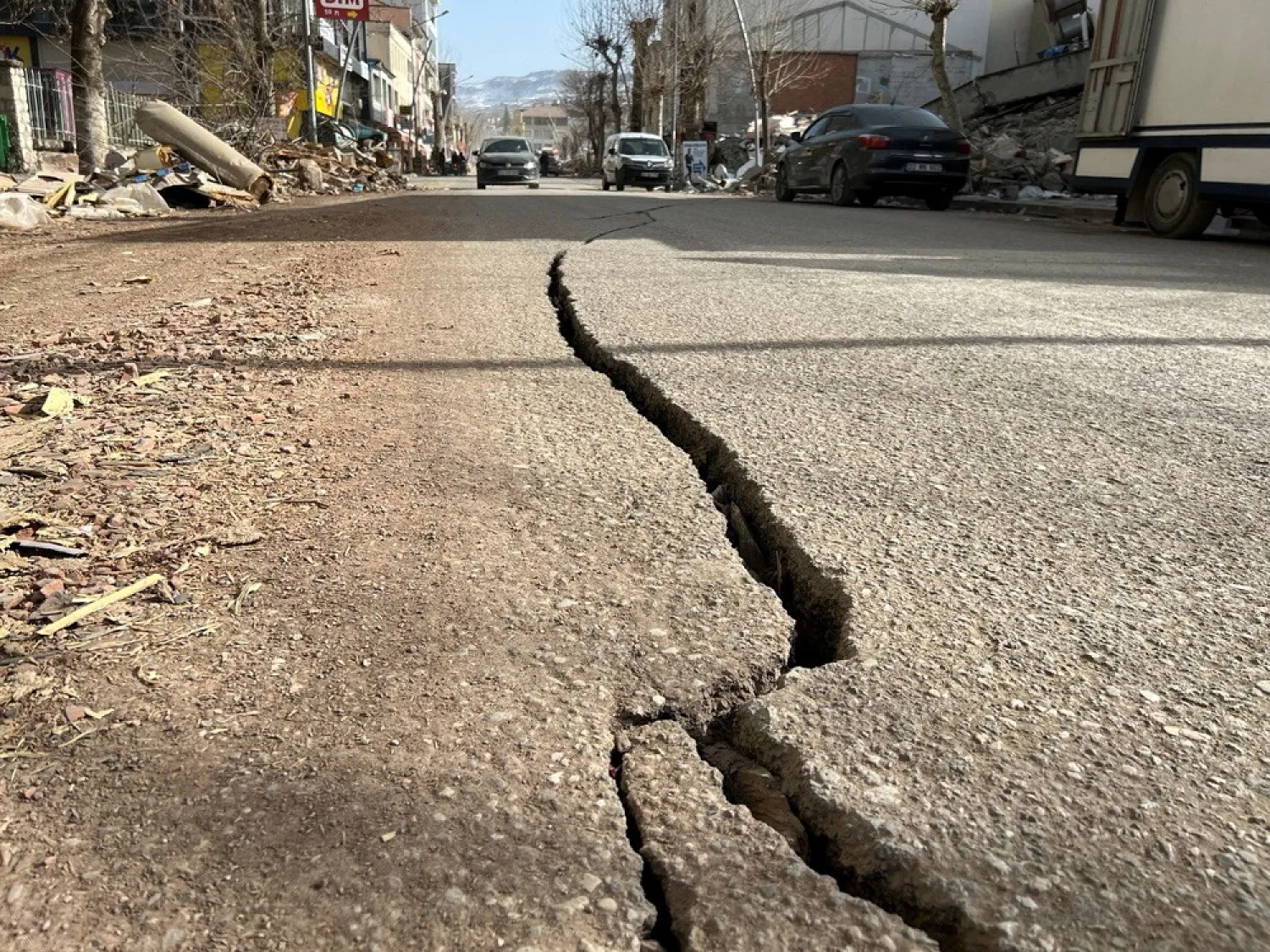 Cracks on a street is pictured in the aftermath of a deadly earthquake in Golbasi in Adiyaman province, Türkiye, March 1, 2023. (Reuters)
