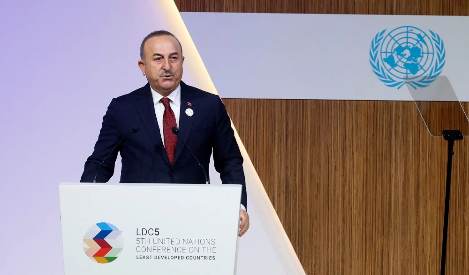 Türkiye's Foreign Minister Mevlut Cavusoglu speaks at the opening session of the fifth United Nations Conference on the Least Developed Countries (LDC5) in Doha, on March 5, 2023. (AFP)
