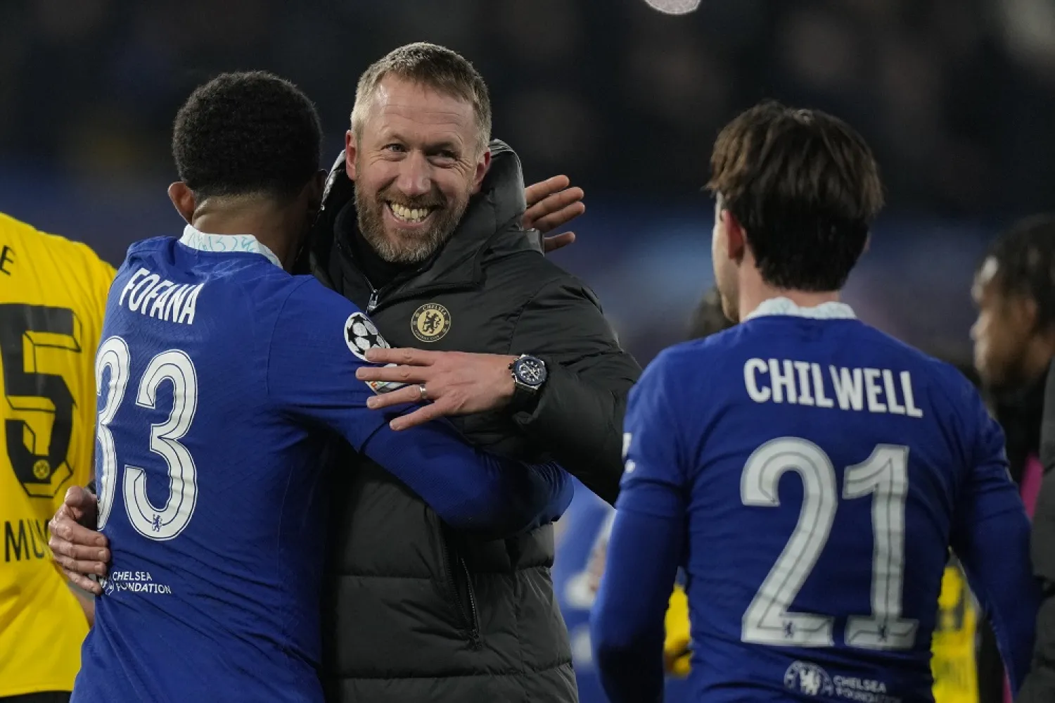 Chelsea's head coach Graham Potter, Peter celebrates with his players Chelsea's Wesley Fofana, left and Chelsea's Ben Chilwell after the end of the Champions League round of 16 second leg  match between Chelsea FC and Borussia Dortmund at Stamford Bridge, London, Tuesday March 7, 2023. Tuesday, March 7, 2023. (AP)
