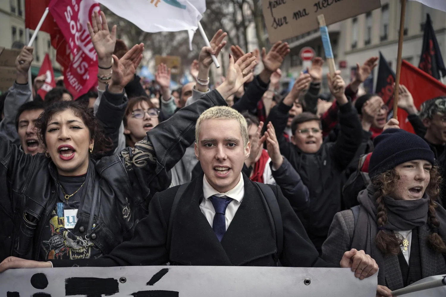 Protesters shout slogans during a demonstration in Lyon, central France, Saturday, March 11, 2023. (AP Photo/Laurent Cipriani)